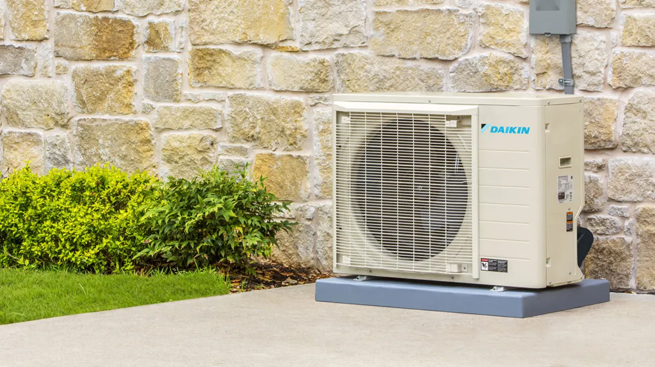 Daikin outdoor HVAC unit installed beside a home